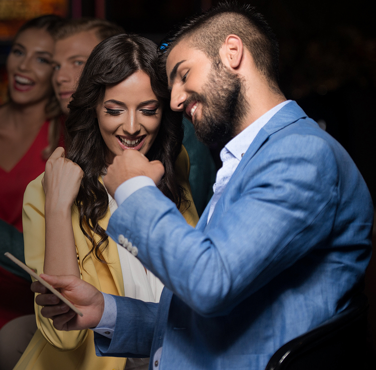 Two people looking at a phone screen